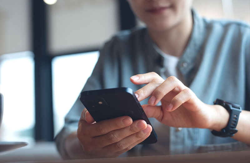 Image of a person using a smartphone